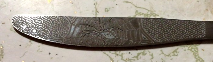 Laser engraved knife done by Black Sheep Blades